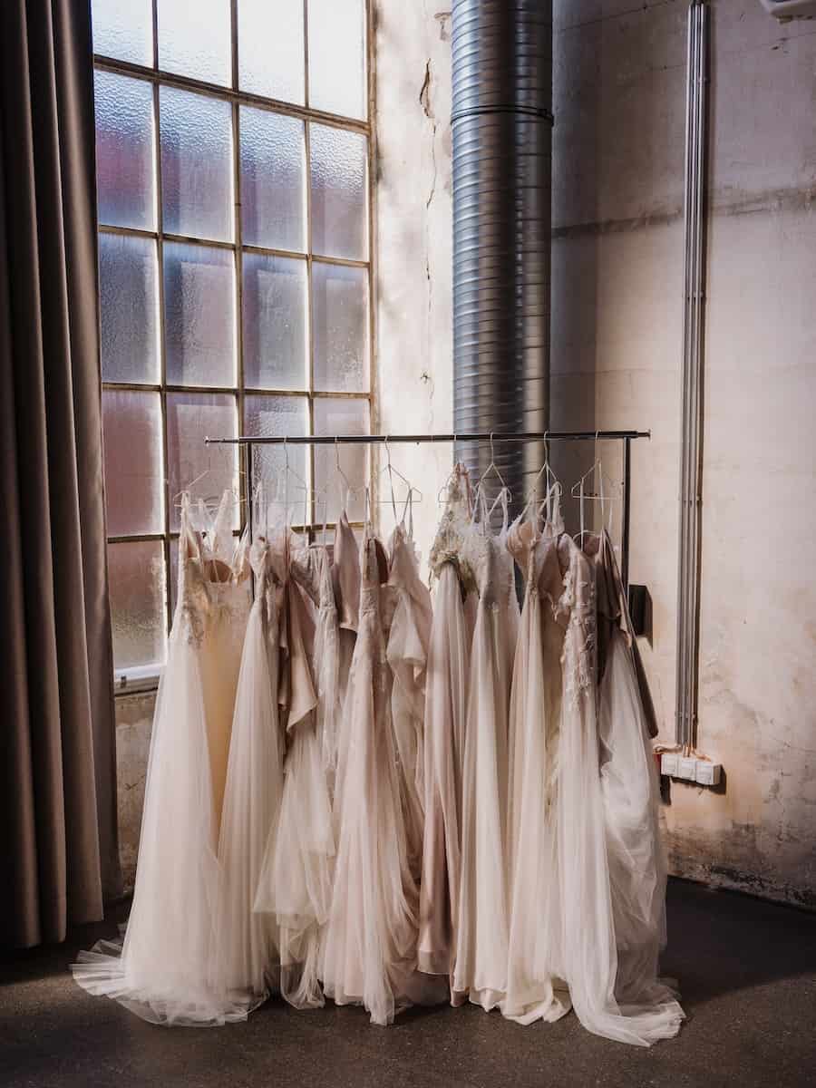 wedding dresses hanging on the rack